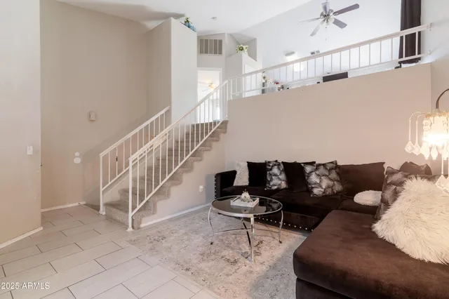 a living room with furniture and a rug