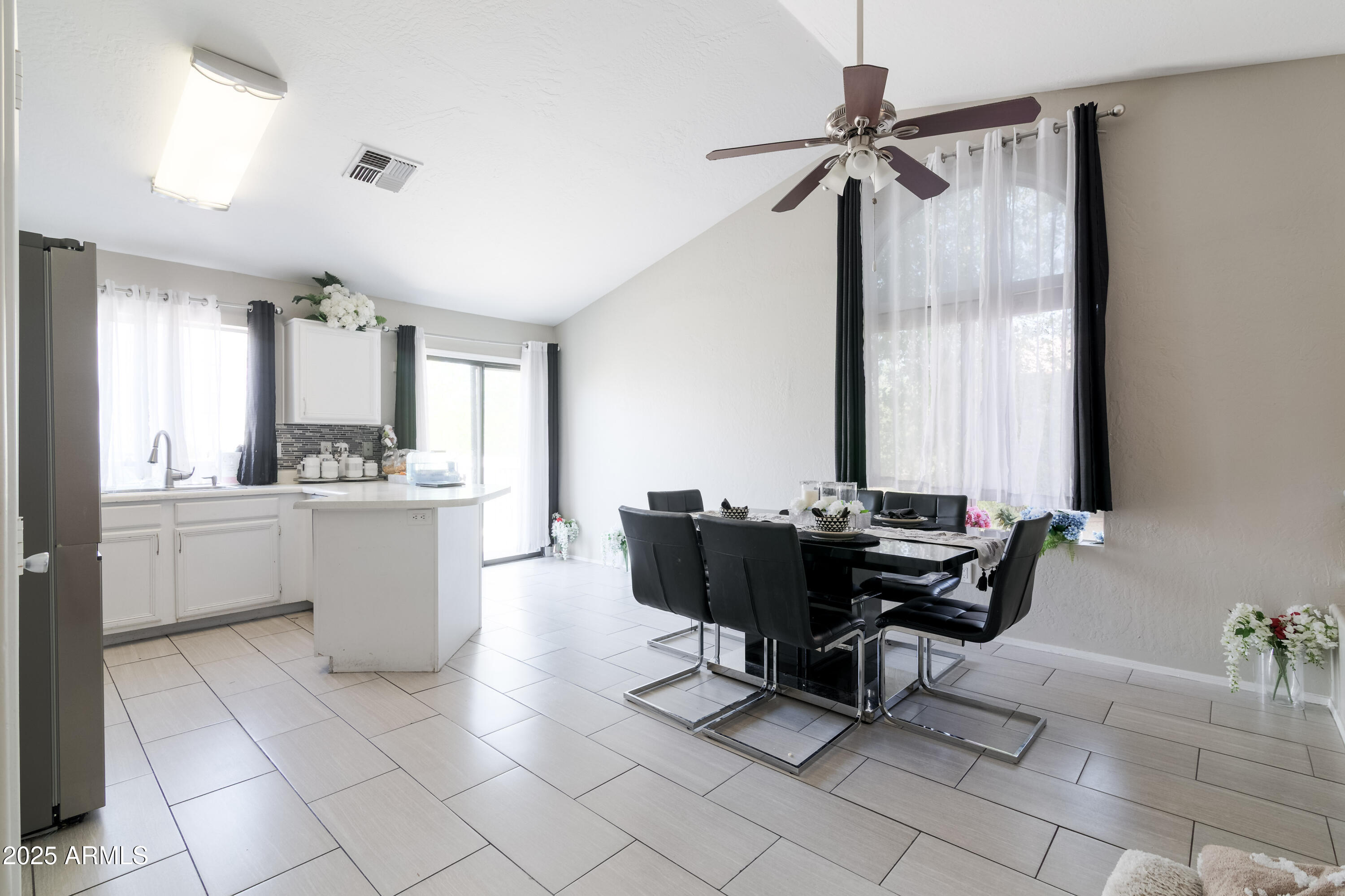 3755 East Broadway Road, Unit 36 Mesa, AZ 85206 - Photo 7 of 24 a living room with furniture and a large window