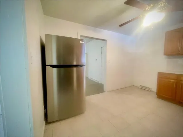a view of a refrigerator in kitchen and a refrigerator