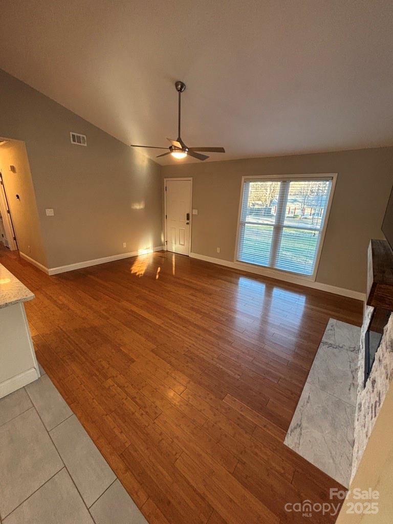 2411 Sutters Road Concord, NC 28027 - Photo 14 of 27 a view of an empty room with window and wooden floor