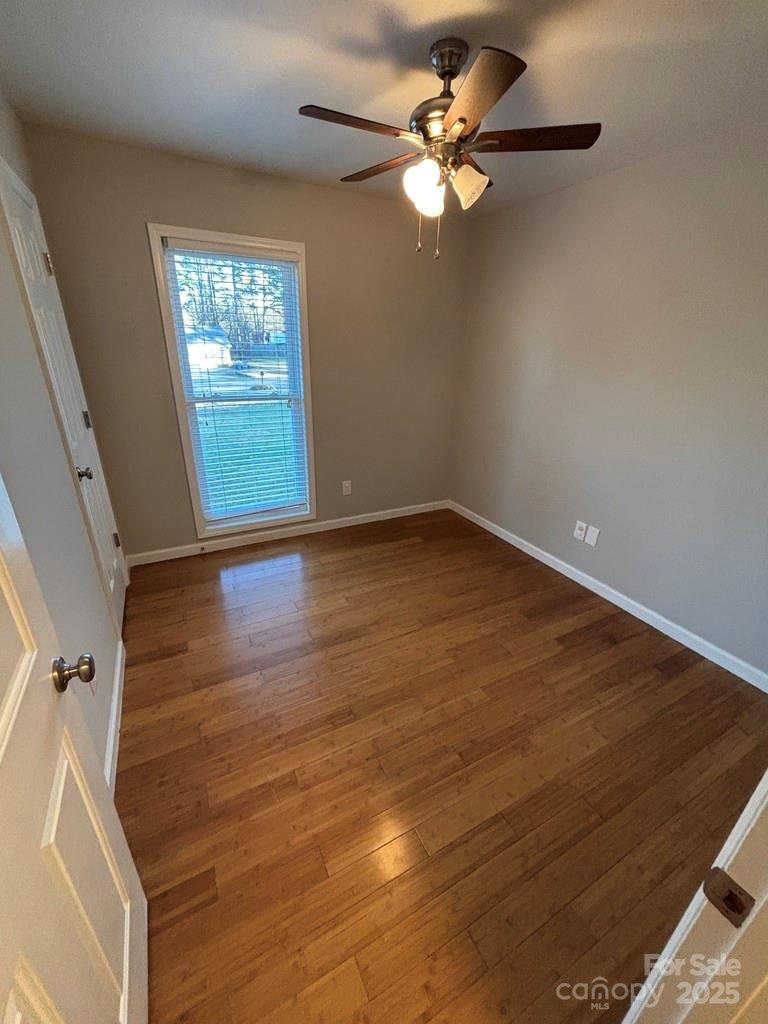 2411 Sutters Road Concord, NC 28027 - Photo 19 of 27 wooden floor in an empty room with a window