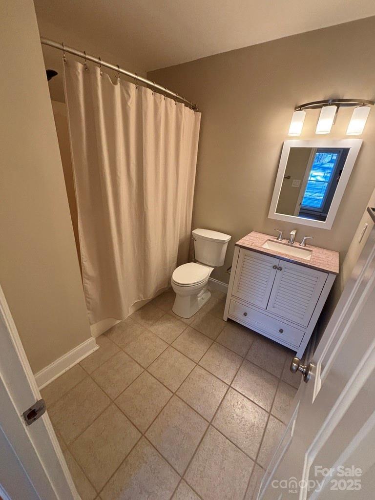 2411 Sutters Road Concord, NC 28027 - Photo 20 of 27 a bathroom with a granite countertop sink and a mirror