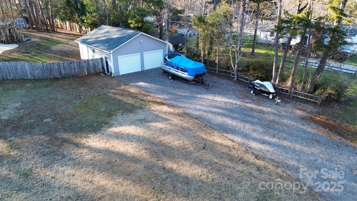 2411 Sutters Road Concord, NC 28027 - Photo 4 of 27 a view of a small house and a yard