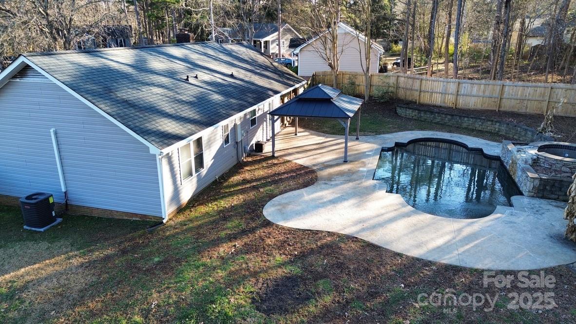 2411 Sutters Road Concord, NC 28027 - Photo 5 of 27 a view of a house with a yard