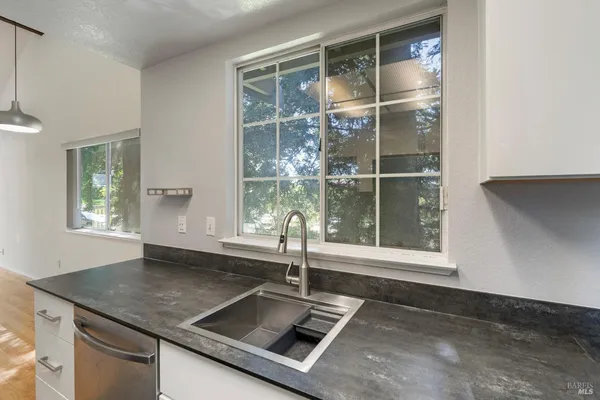 a kitchen with sink and window
