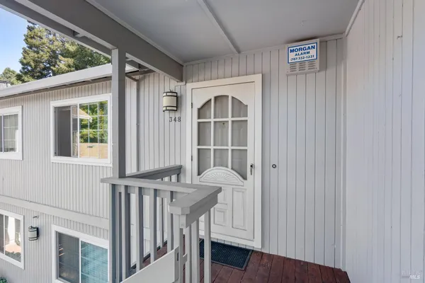 a view of staircase with white walls and windows