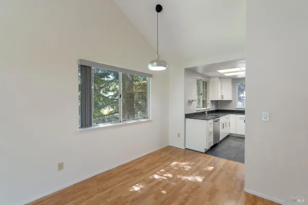 a kitchen with a refrigerator and window