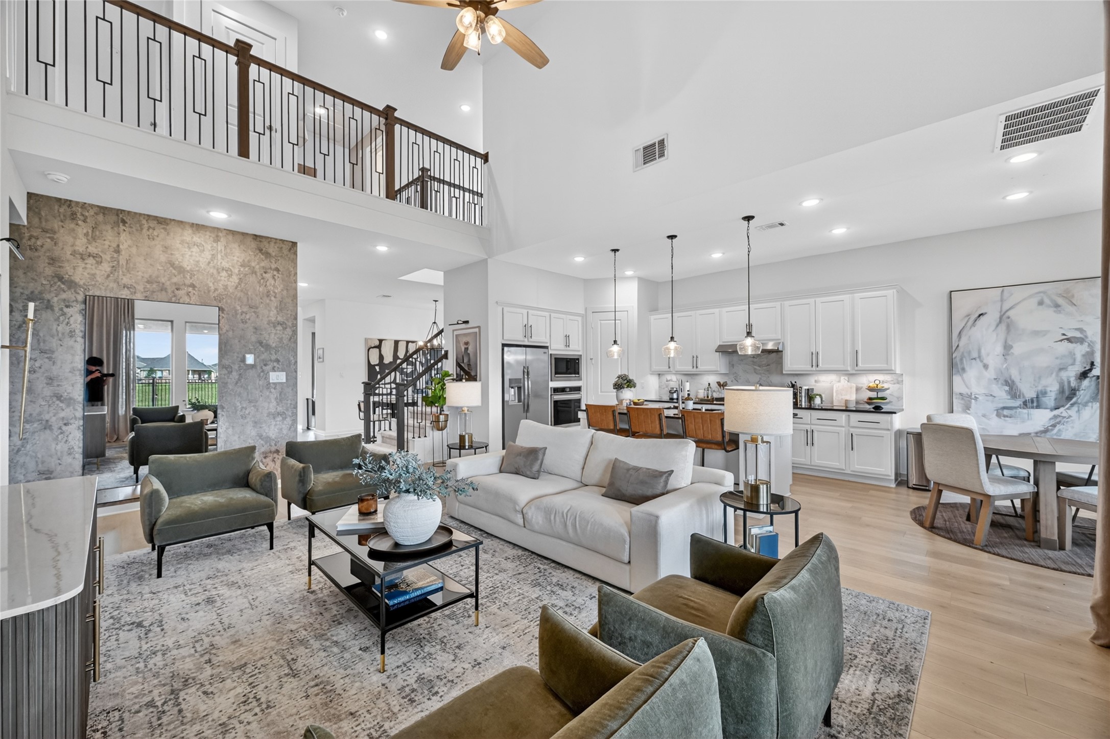 4439 Stone Ridge Lane Manvel, TX 77578 - Photo 7 of 48 a living room with furniture kitchen view and a chandelier