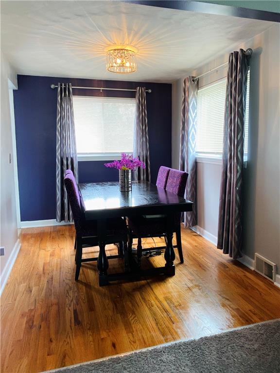 543 Grove Road Verona, PA 15147 - Photo 4 of 24 Dining room as viewed from the living room. Windows look out onto the northwesterly side yard and wood deck/back yard. Kitchen, basement entrance and exit to the wood deck are all located through the doorway to the left.