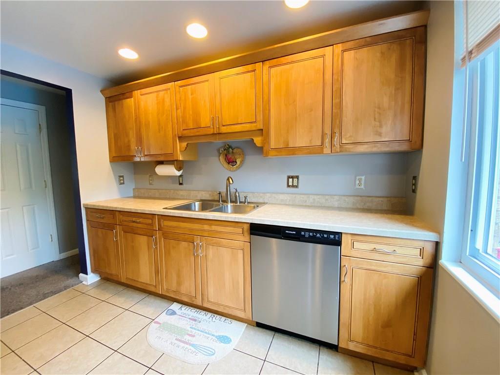 543 Grove Road Verona, PA 15147 - Photo 7 of 24 Kitchen as viewed when standing at the door to the wood deck/back door. Living room to the left and bedrooms/full bath down the hall to the right.