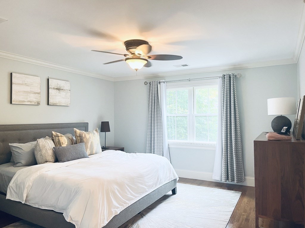 8 Cragmore Road, Unit 8 Newton, MA 02464 - Photo 11 of 27 a bedroom with a bed and a window