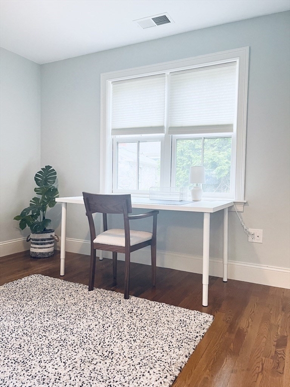 8 Cragmore Road, Unit 8 Newton, MA 02464 - Photo 18 of 27 a living room with furniture and a window