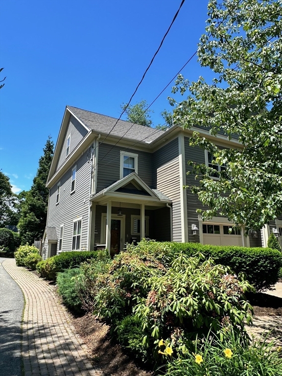 8 Cragmore Road, Unit 8 Newton, MA 02464 - Photo 2 of 27 a front view of a house with a yard