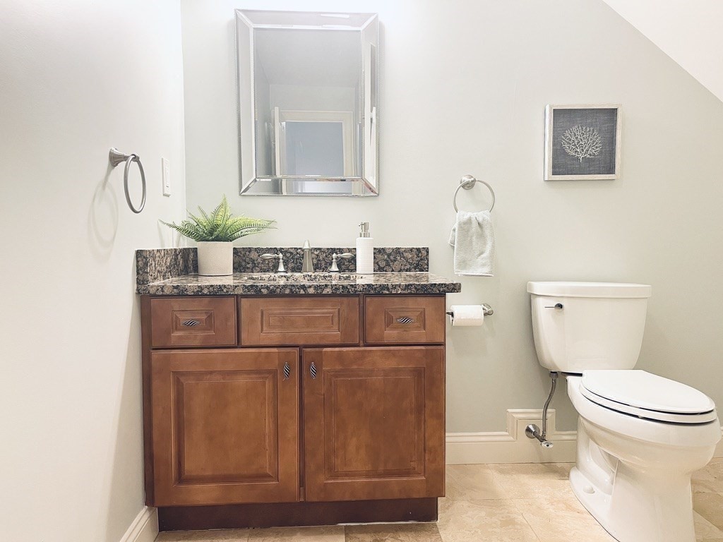 8 Cragmore Road, Unit 8 Newton, MA 02464 - Photo 21 of 27 a bathroom with a toilet sink and mirror