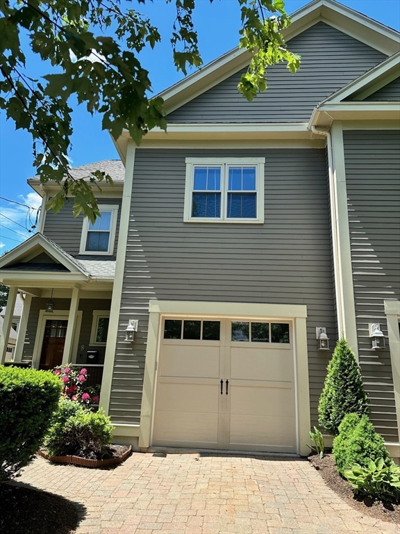 8 Cragmore Road, Unit 8 Newton, MA 02464 - Photo 25 of 27 a front view of a house with a yard