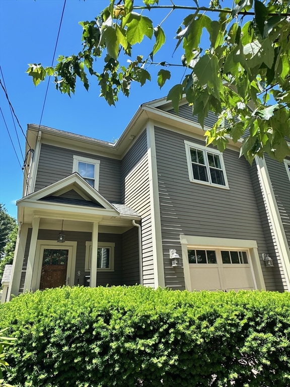 8 Cragmore Road, Unit 8 Newton, MA 02464 - Photo 26 of 27 a front view of a house with a yard