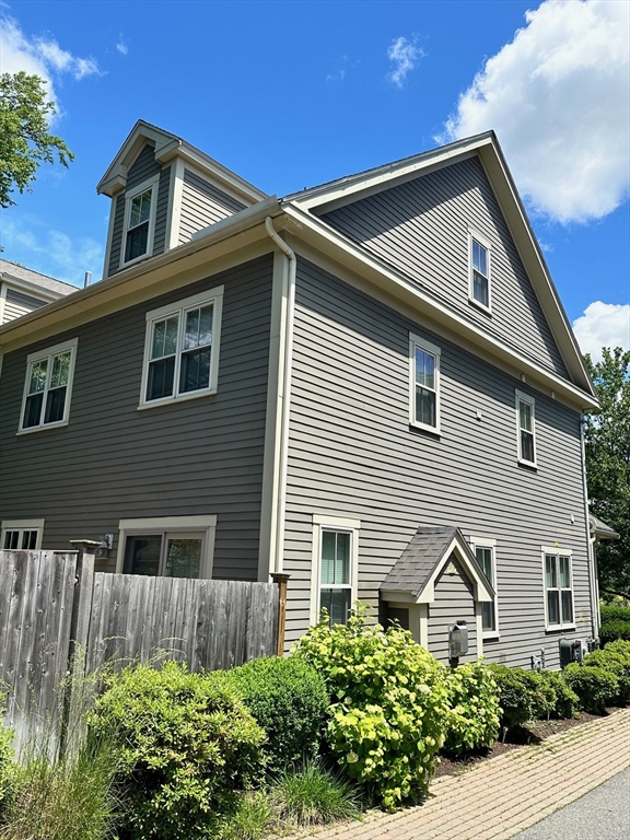 8 Cragmore Road, Unit 8 Newton, MA 02464 - Photo 27 of 27 a front view of a house with a yard