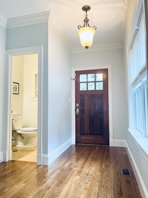 8 Cragmore Road, Unit 8 Newton, MA 02464 - Photo 4 of 27 a view of empty room with window and wooden floor