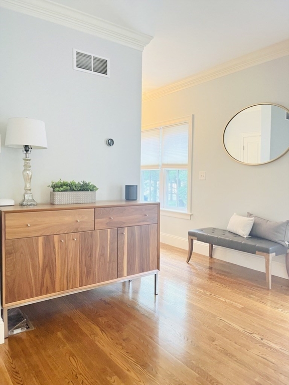 8 Cragmore Road, Unit 8 Newton, MA 02464 - Photo 5 of 27 a living room with furniture and a wooden floor