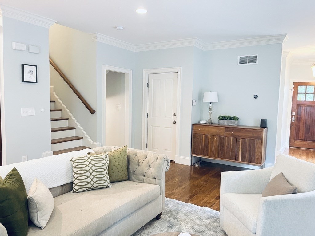 8 Cragmore Road, Unit 8 Newton, MA 02464 - Photo 7 of 27 a living room with furniture and a wooden floor