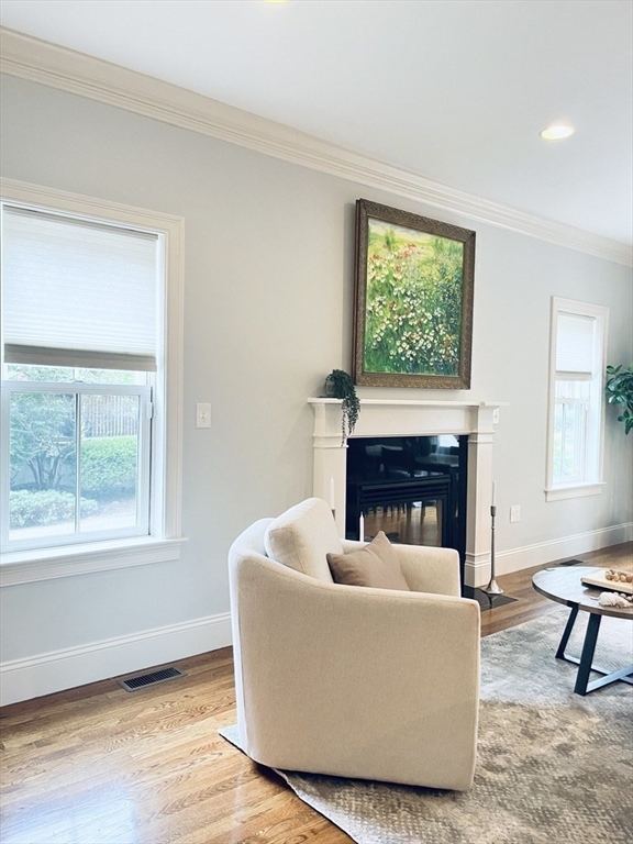 8 Cragmore Road, Unit 8 Newton, MA 02464 - Photo 8 of 27 a living room with furniture a fireplace and a window