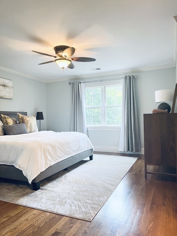 8 Cragmore Road, Unit 8 Newton, MA 02464 - Photo 10 of 27 a bedroom with a bed and wooden floor