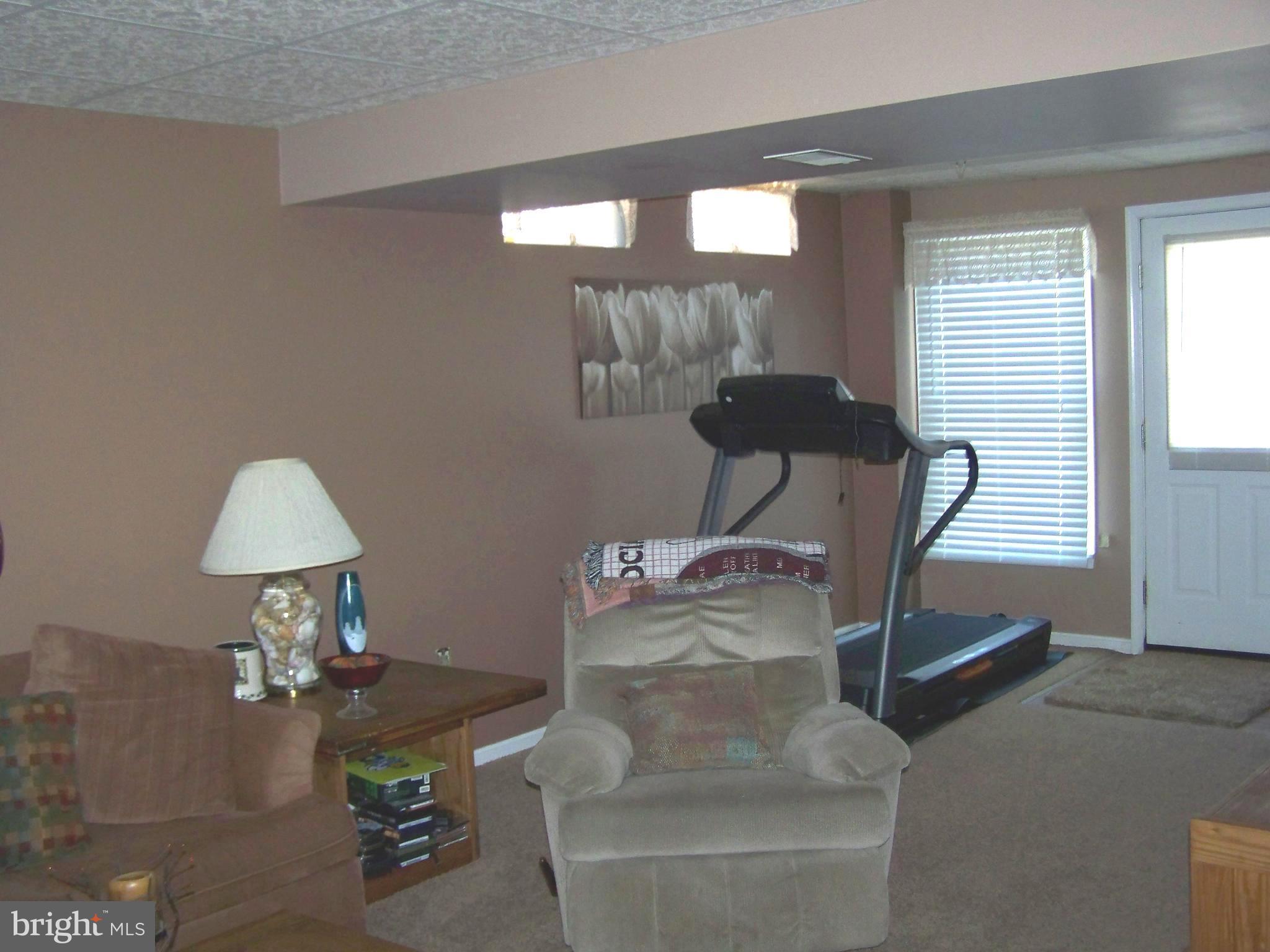 9229 Bretton Reef Road Baltimore, MD 21234 - Photo 26 of 30 Lower Level Family Room, daylight, walk out