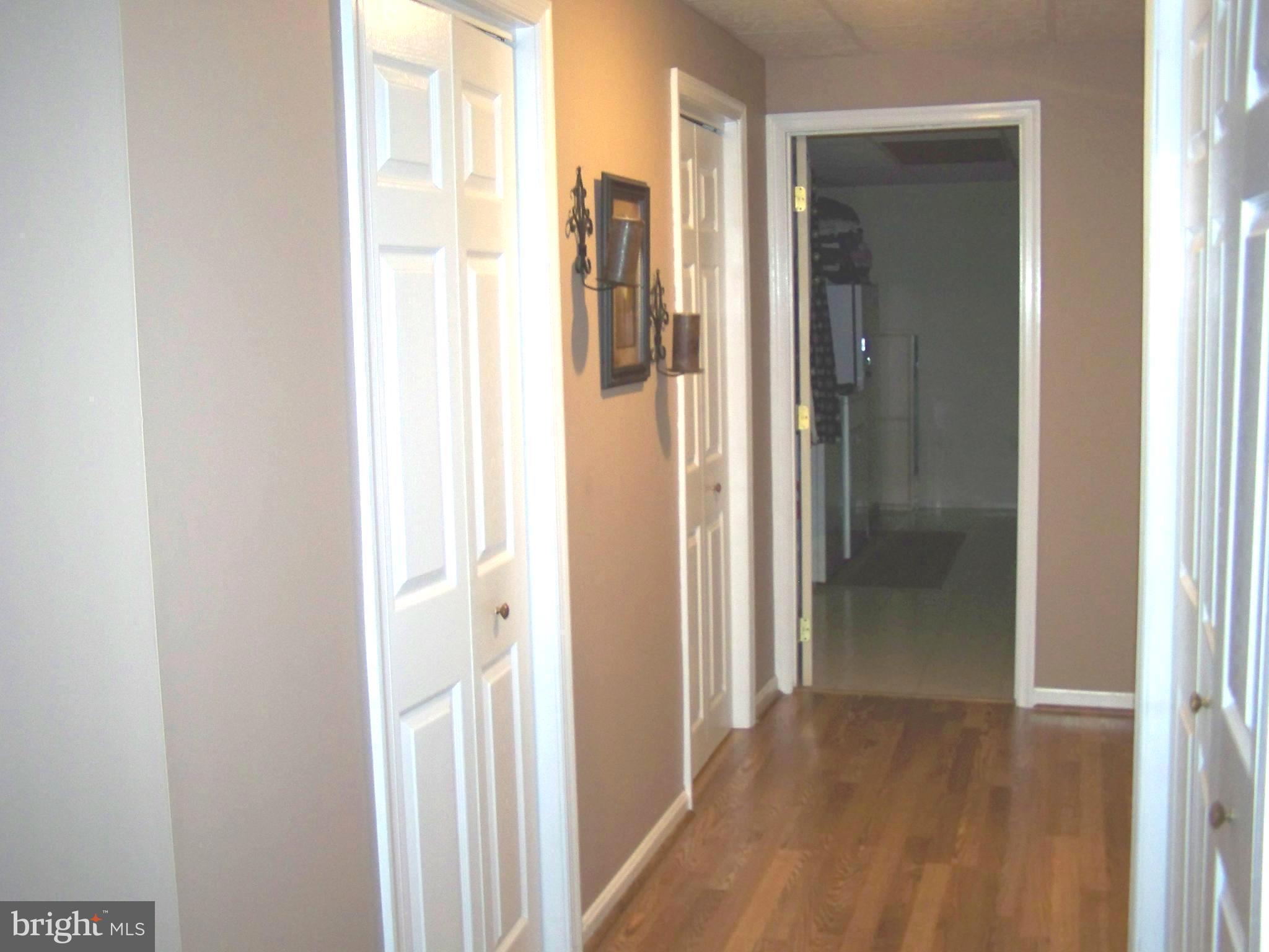 9229 Bretton Reef Road Baltimore, MD 21234 - Photo 28 of 30 Lower Level hall w/powder room and ample storage
