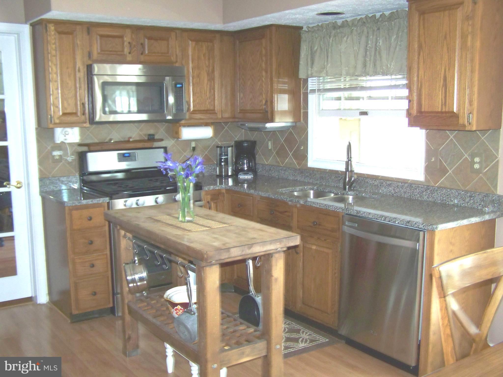 9229 Bretton Reef Road Baltimore, MD 21234 - Photo 6 of 30 Kitchen with Granite Counters, Stainless, Island