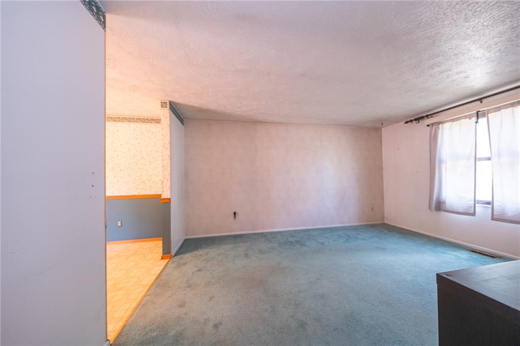 1310 Greenhill Rd Extension Pittsburgh, PA 15209 - Photo 11 of 39 an empty room with windows