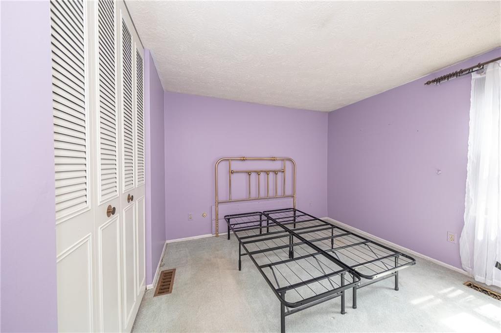 1310 Greenhill Rd Extension Pittsburgh, PA 15209 - Photo 17 of 39 an empty room with windows