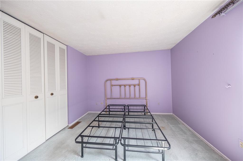 1310 Greenhill Rd Extension Pittsburgh, PA 15209 - Photo 18 of 39 a view of a livingroom with a chair and wooden floor
