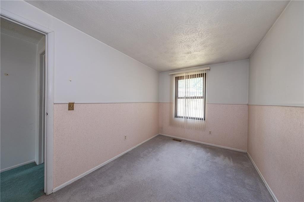 1310 Greenhill Rd Extension Pittsburgh, PA 15209 - Photo 20 of 39 an empty room with a window