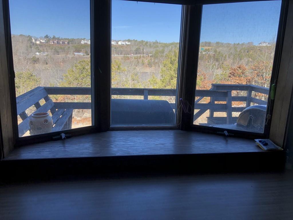 25 Long Boat Road Bourne, MA 02532 - Photo 3 of 23 a view of an empty room with wooden floor and windows