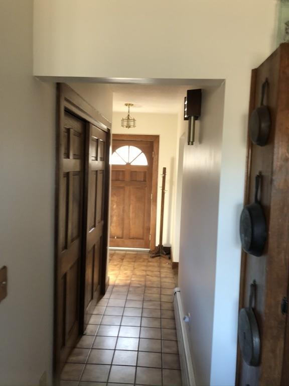25 Long Boat Road Bourne, MA 02532 - Photo 9 of 23 a view of a refrigerator in kitchen and an empty room