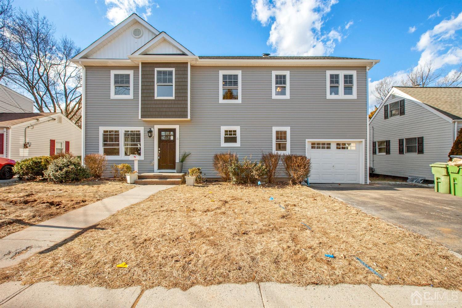 6 Clausen Road Edison, NJ 08817 - Photo 1 of 1 a front view of a house with a yard