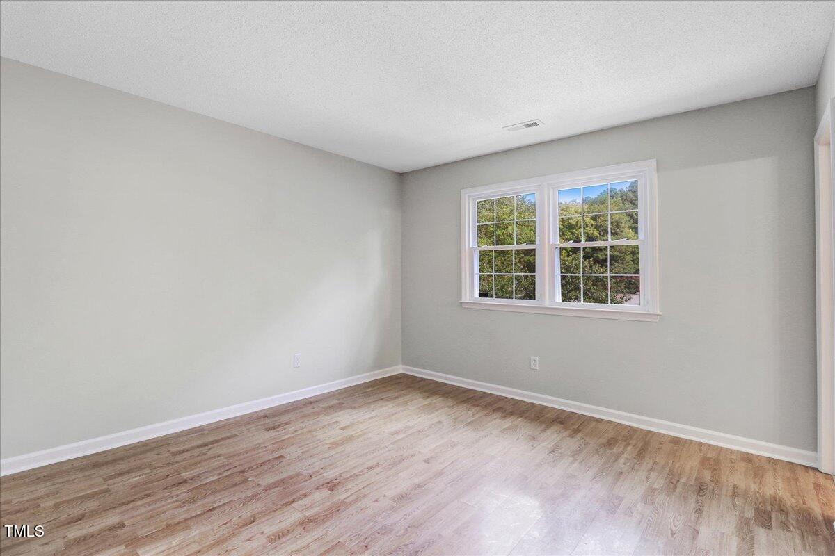 216 Bracken Court Raleigh, NC 27615 - Photo 24 of 27 Second Bedroom upstairs view