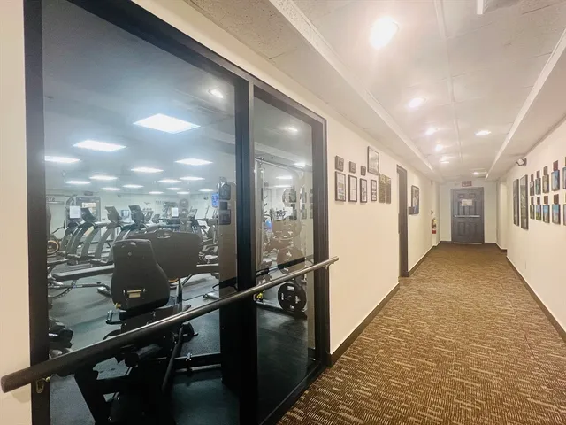 a view of a hallway with windows