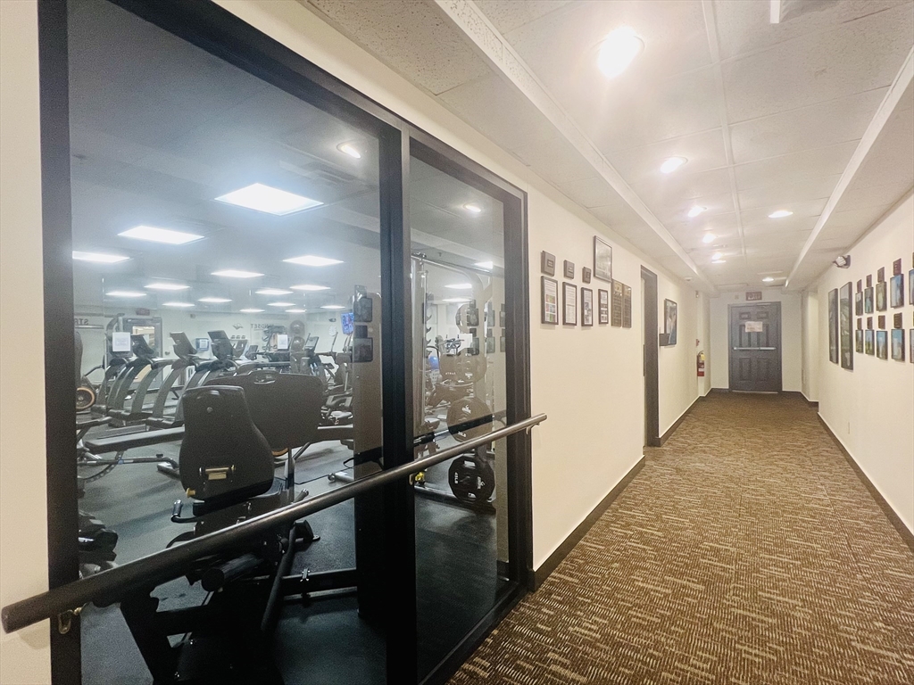 619 White Cliffs Drive, Unit 619 Plymouth, MA 02360 - Photo 12 of 42 a view of a hallway with windows