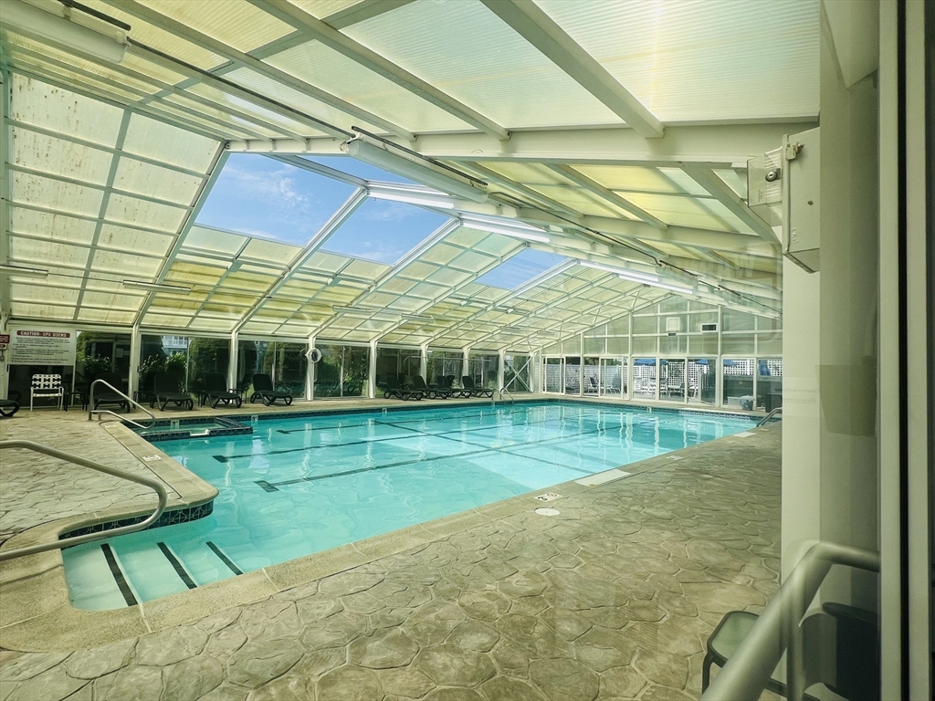 619 White Cliffs Drive, Unit 619 Plymouth, MA 02360 - Photo 13 of 42 a view of a backyard with a table and chair
