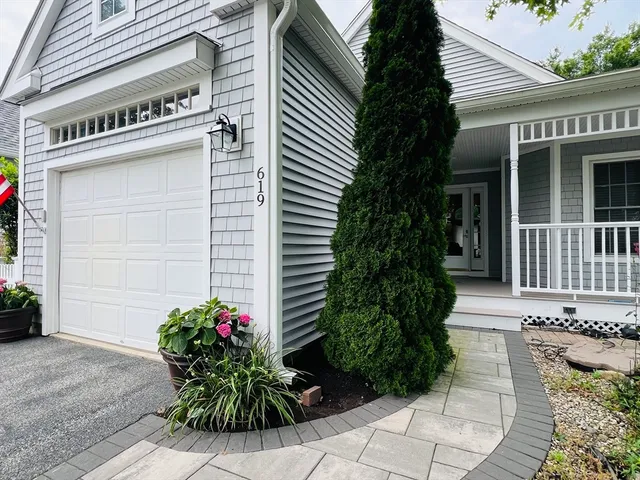 a potted plant sitting on the side of a building