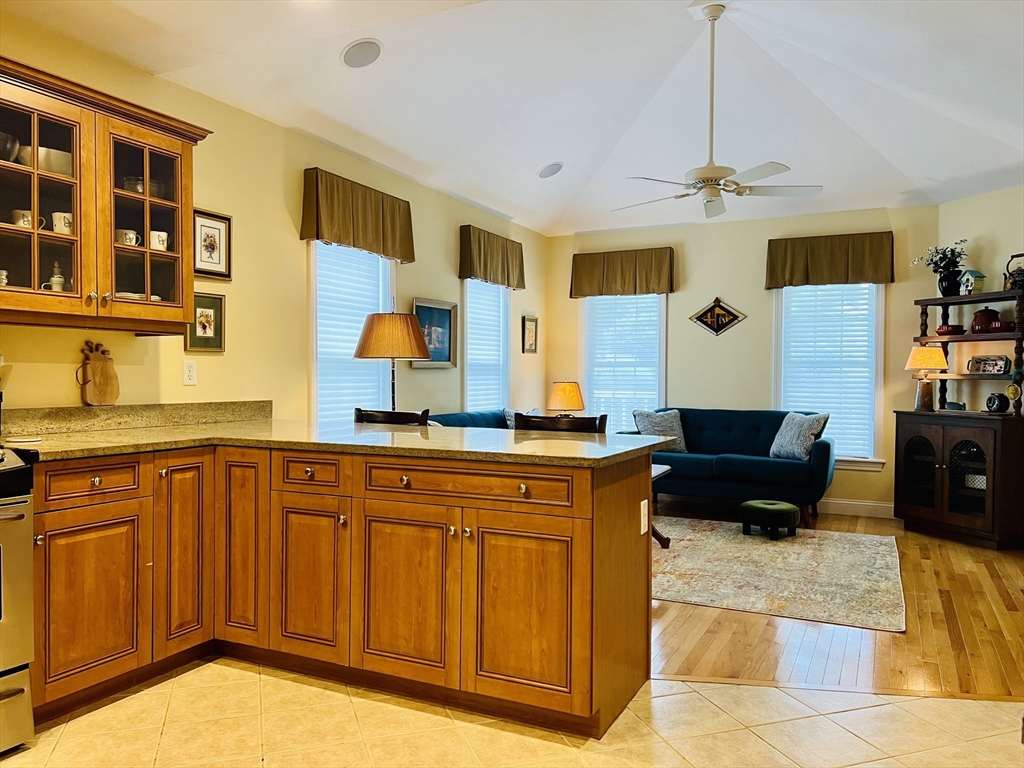 619 White Cliffs Drive, Unit 619 Plymouth, MA 02360 - Photo 18 of 42 a living room with stainless steel appliances granite countertop furniture and a kitchen view