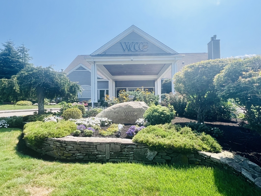 619 White Cliffs Drive, Unit 619 Plymouth, MA 02360 - Photo 3 of 42 a front view of a house with a yard