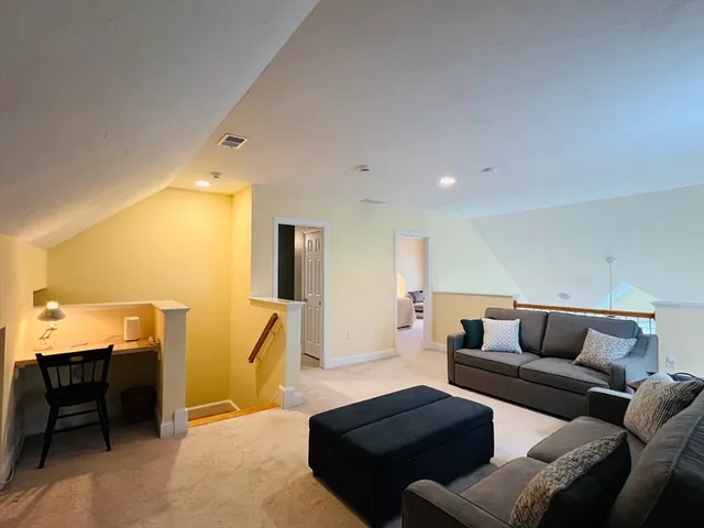 a living room with furniture a rug and a couch