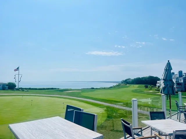 a view of a golf course with a lake