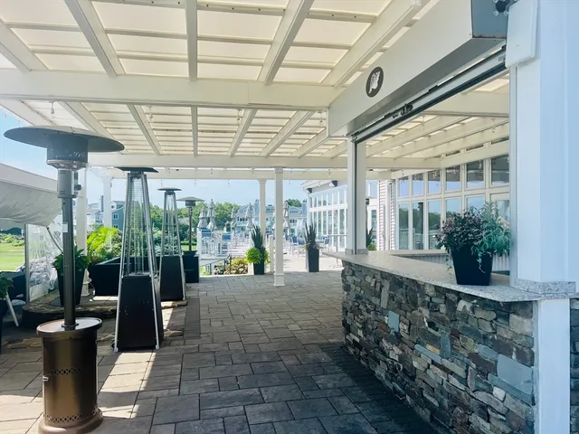 a view of a porch with dining table and chairs
