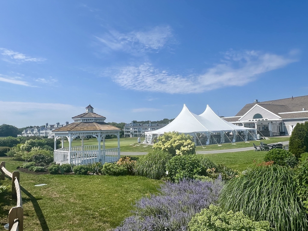 619 White Cliffs Drive, Unit 619 Plymouth, MA 02360 - Photo 6 of 42 a front view of a house with garden