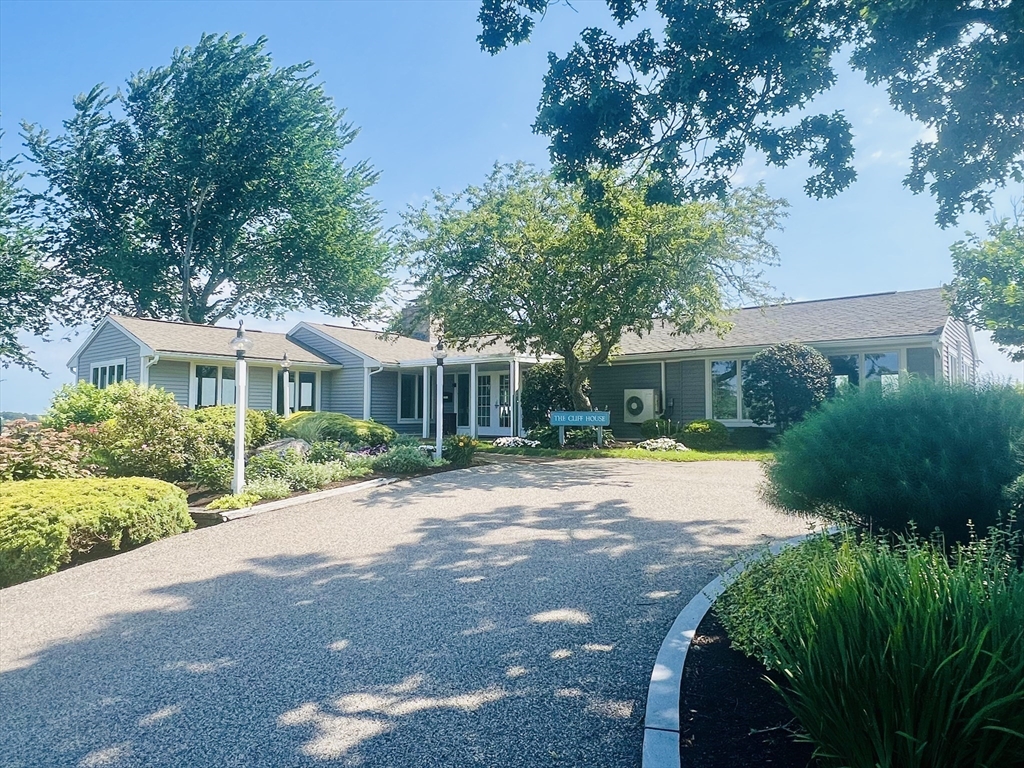 619 White Cliffs Drive, Unit 619 Plymouth, MA 02360 - Photo 8 of 42 a view of a house with backyard and garden