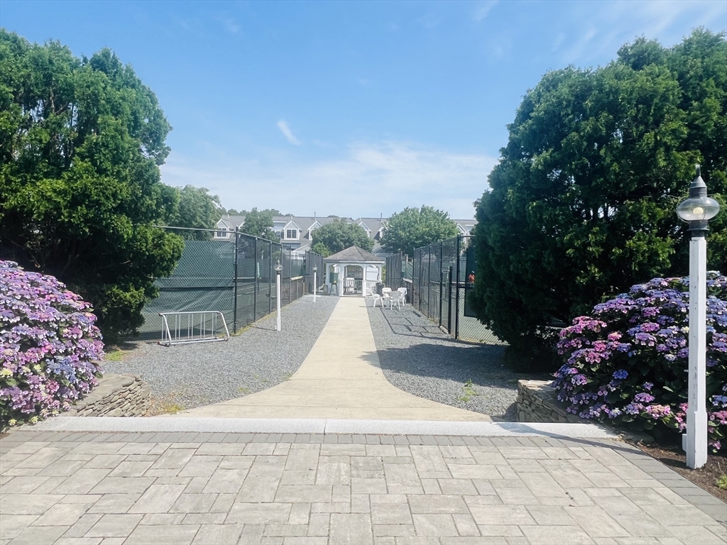 619 White Cliffs Drive, Unit 619 Plymouth, MA 02360 - Photo 9 of 42 a view of a backyard