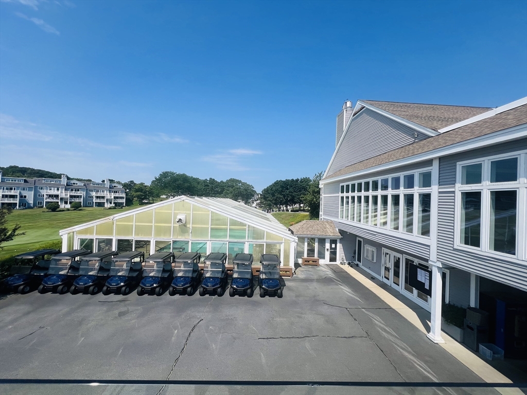 619 White Cliffs Drive, Unit 619 Plymouth, MA 02360 - Photo 10 of 42 a view of a house with a balcony